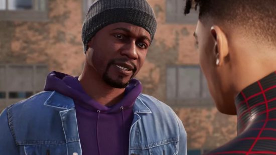 Spiderman 2 characters: Aaron Davis wearing a black beanie and a blue denim jacket over a black hoodie