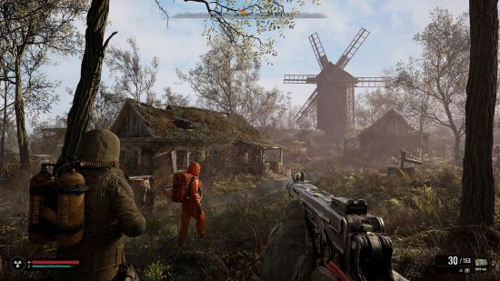 Xbox exclusives: A player holding a weapon at the ready and following two characters walking through a dilapidated village in Stalker 2.