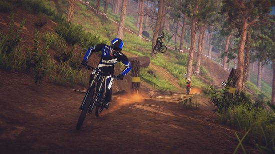Xbox Game Pass Core games: A mountain biker dressed in black and blue racing down a wooded mountain in Descenders. 