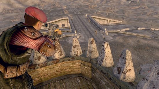 Best RPG games: A soldier in red uniform aims down the scope of a sniper rifle from the top of a tower down onto a road bridge below