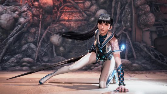 PS5 exclusives: The main character of Stellar Blade crouched down on one arm holding her sword in her other hand.