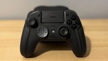 Nacon Revolution 5 Pro review: A black Nacon Reovlution 5 Pro PS5 controller leaning against its black carry case on a wooden surface