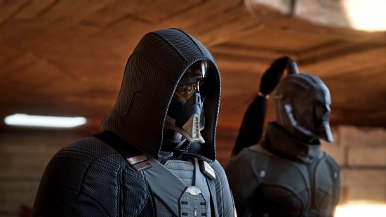 Dune Awakening preview GDC: a hooded man wearing a mask, clad in black, next to another character with a long ponytail, also clad in black