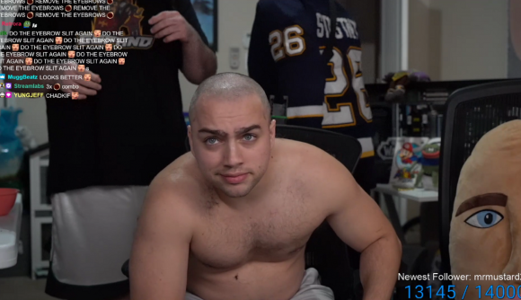 Streamer Mizkif looking into the camera with apathy after shaving his head