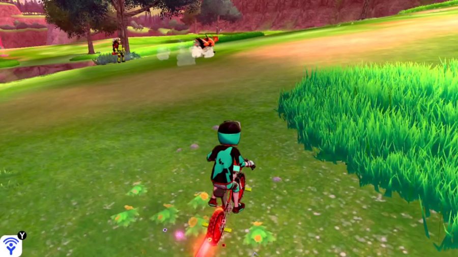 Galarian Zapdos is running away from the trainer, who is riding a bike, in the Wild Area. It has sweat marks above its head, which indicates that it's getting tired.