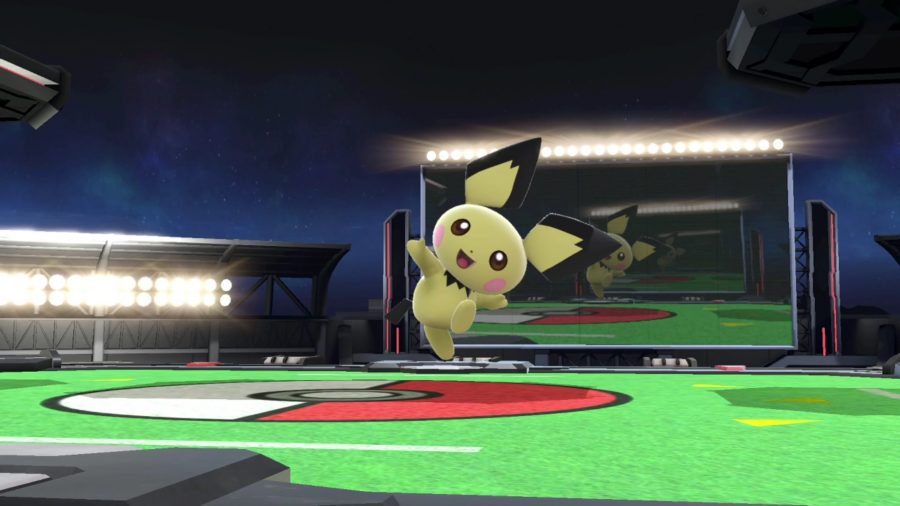 Pichu is jumping for joy on the battlefield of Pokémon Stadium.