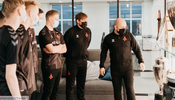 Astralis' CS:GO talent team looking at the team's trophy cabinet