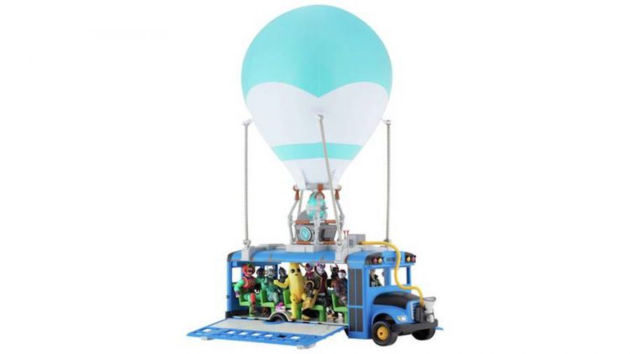 A Fortnite battle bus toy with pull out sides and an inflatable balloon