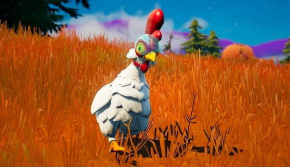 A chicken looks angry in Fortnite, as it stalks among the orange shrubbery