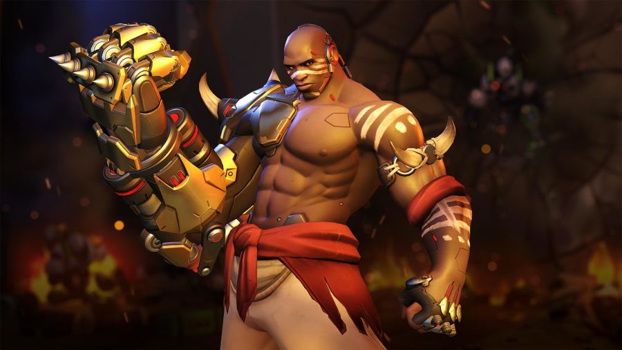 Doomfist holds his fist up to his face while standing menancingly