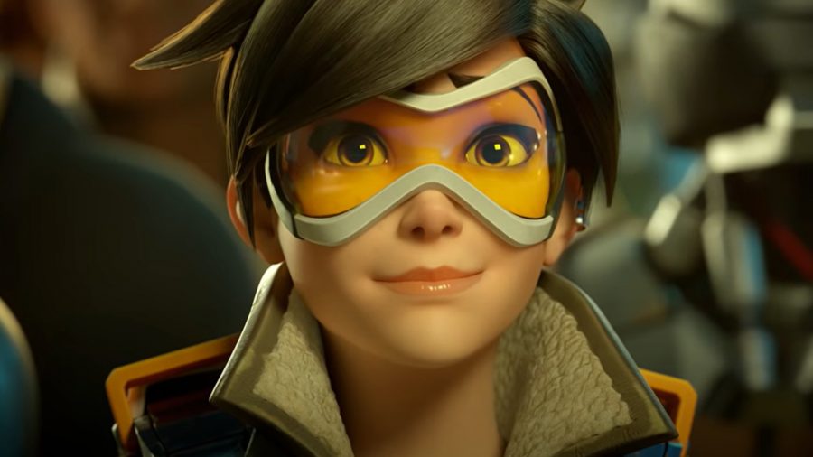 Tracer smiles as she looks up in Overwatch