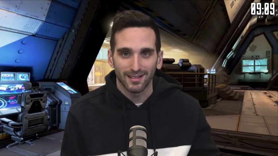 Falloutt wearing a black hoodie, casting an Apex Legends tournament