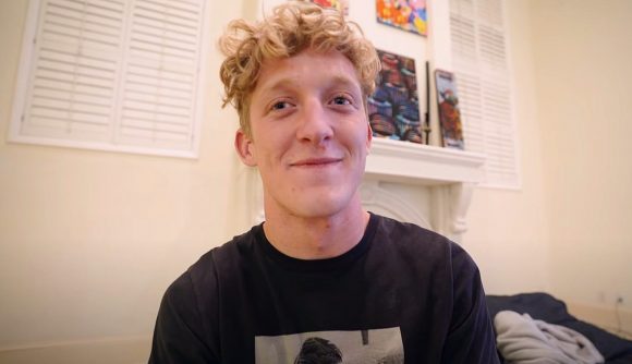 Streamer Tfue with blond curly hair, wearing a black t shirt