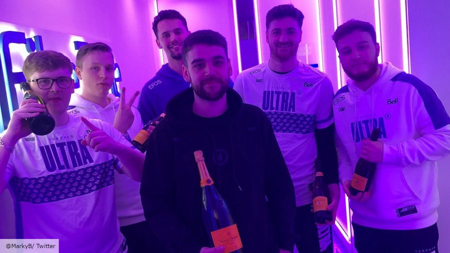 The Toronto Ultra Call of Duty team pose for a victory photo holding bottles of champagne