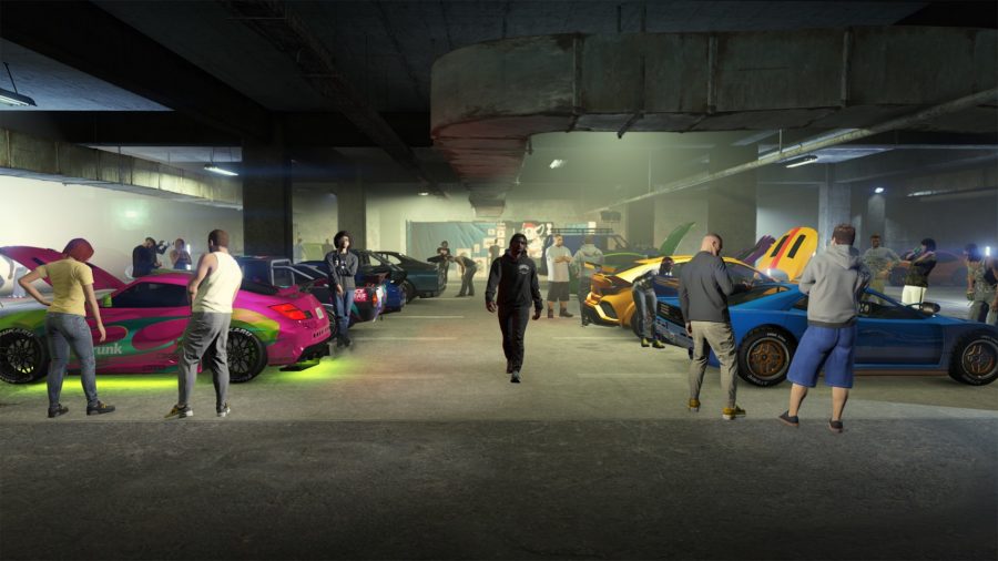 A man walks down the middle of a busy underground GTA 5 car meet