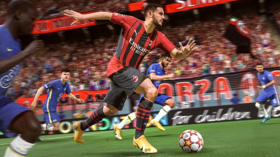 An AC Milan player runs with the ball as we his surrounded by several Chelsea players in FIFA 22