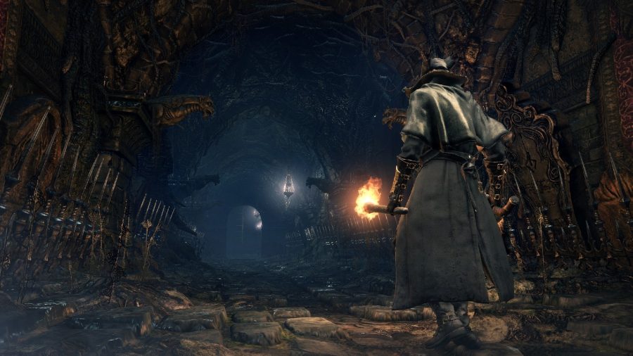 A hunter can be seen walking down a narrow pathway.