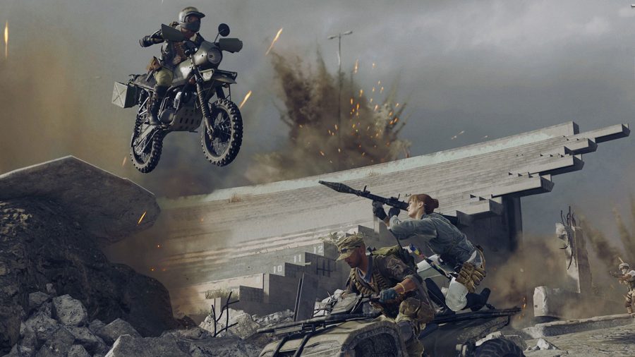 A player on the back of a quad bike aims a rocket launcher at another player riding a bike