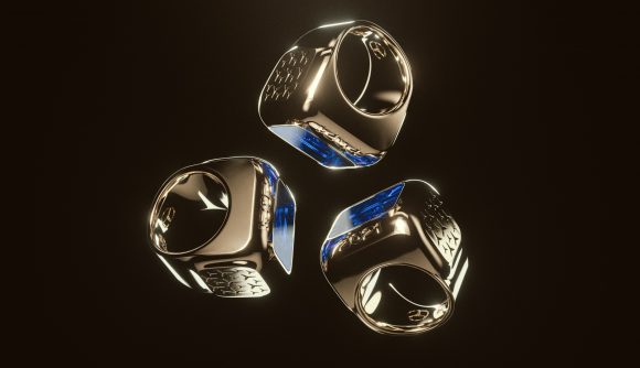 Three gold rings, awarded to the winners of League of Legends Worlds 2021, on a black background