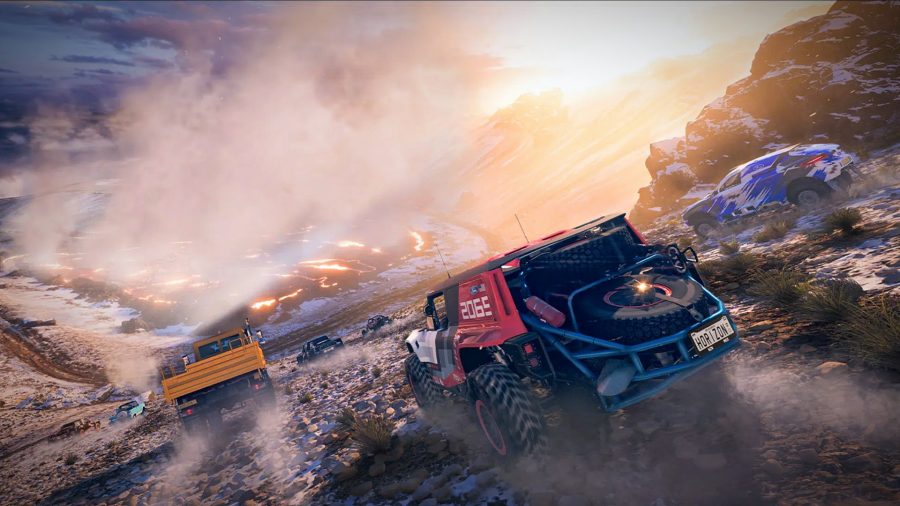 Forza Horizon 5 review: Three off-road cars descend down the side of volcano crater. A pool of lava smoulders ahead of them 