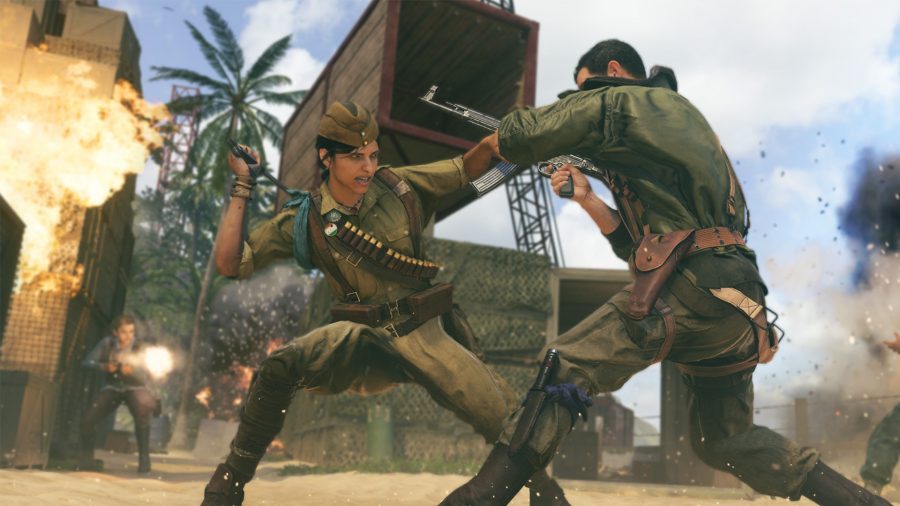 Two Vanguard players grapple in the middle of a gunfight. One is wielding a melee weapon resembling a baton, the other has an assault rifle in hand