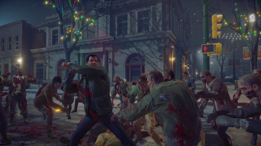Xbox Games With Gold December 2021: Frank can be seen hitting some zombies with a melee weapon.