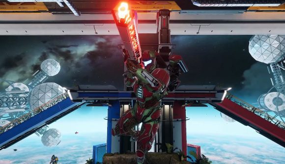 A Splitgate character in red armour floats in the air, charging up a shot from a long-barrelled rifle