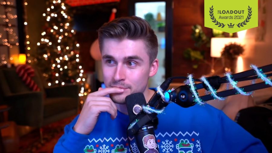 A screenshot of streamer Ludwig sat behind a streaming mic, wearing a blue Christmas jumper