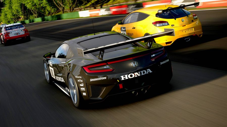 Gran Turismo 7 Car List: Two cars racing around a track. One is a black Honda and one is yellow.