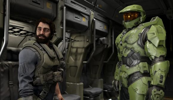 The Pilot and Master Chief can be seen standing next to each other in the hull of an aircraft.