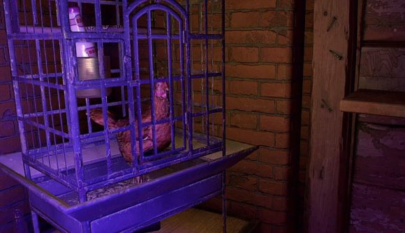 Brunek, the alien chicken can be seen in his cage.