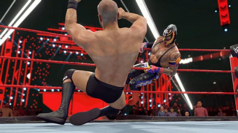 wwe 2k22 game pass: wrestlers grabbing each other in the ring