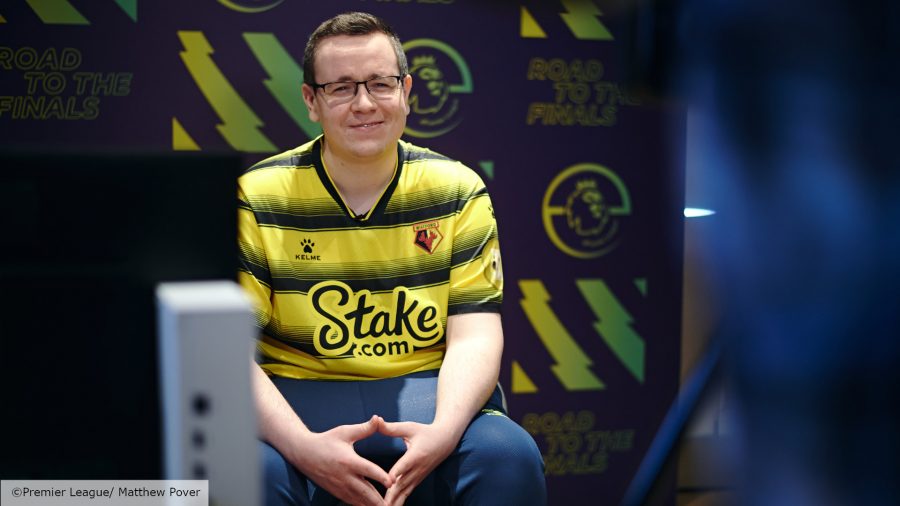 FIFA 22 ePremier League: Watford competitor Tom Stokes smiles into the camera wearing Watford's yellow and black striped kit