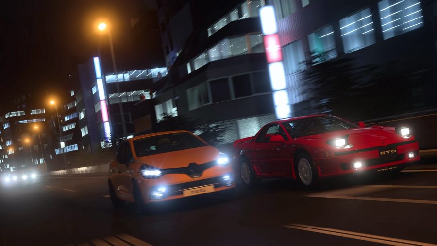 Gran Turismo 7 review: Two cars drive side by side at night on the streets of Tokyo. One is a red Mitsubishi, the other is a yellow Renault
