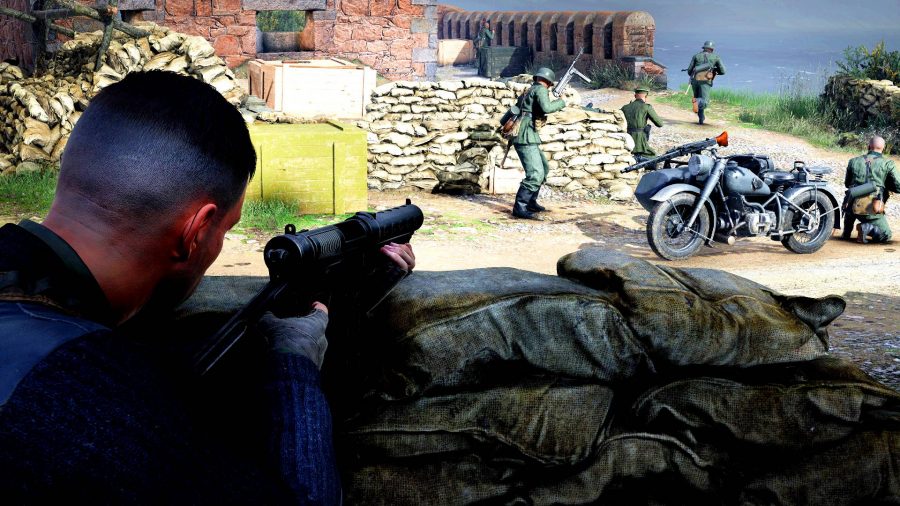 Sniper Elite 5 Preview: A man using an SMG behind sandbags