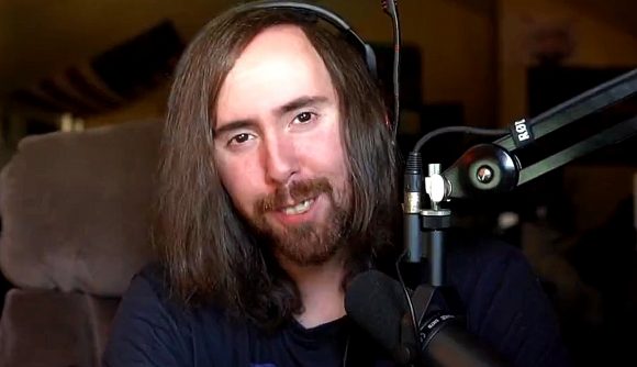 Asmongold OTK Games Expo Indie Games: An image of Asmongold with long hair infront of a mic