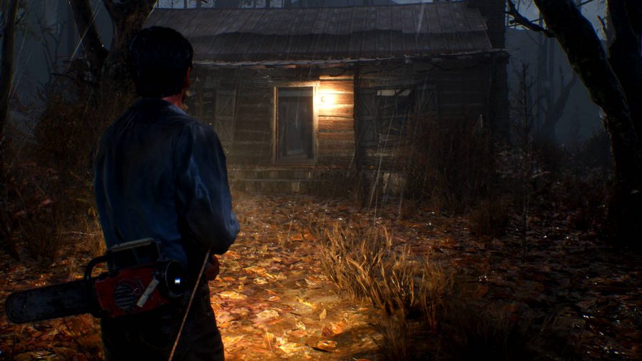 Evil Dead The Game Review: An image of Ash in-game in front of the cabin from Evil Dead and Evil Dead 2