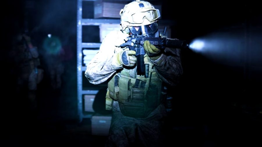 Modern Warfare 2 DMZ mode: An image of a solider in the darkness with a barrel-mounted torch