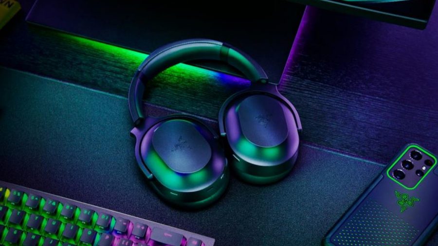 Razer Barracuda review: A wireless Razer headset on a desk with a gaming keyboard and phone
