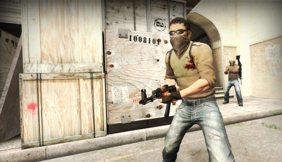 CSGO patch notes June 15: An operator in a brown shirt and grey trousers wields an assault rifle