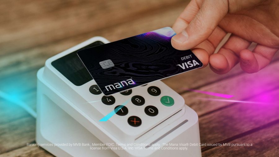 A close up of a Mana debit card being used