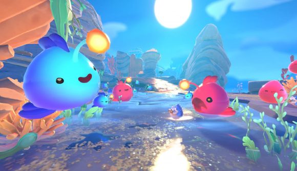 Slime Rancher 2 Gameplay: Multiple slimes can be seen in an area of the game.
