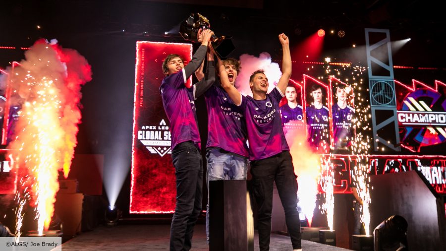 Apex Legends ALGS Year 2: DarkZero esports lift the ALGS trophy with flames and sparks shooting out behind them