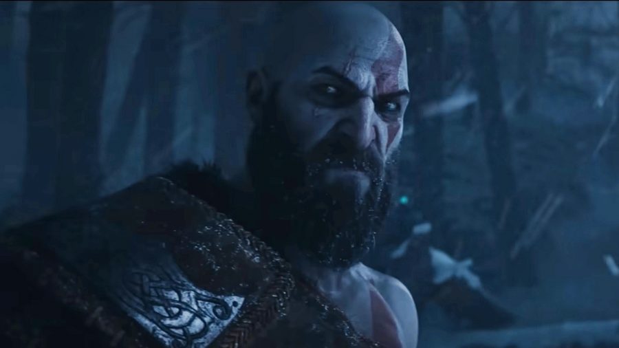 god of war ragnarok voice actors cast kratos looks at the camera in a dark forest