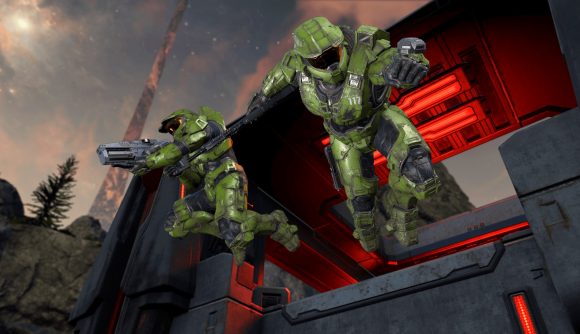 Halo Infinite devs new studio: Two spartans in green armour leap from a ledge with their weapons in hand