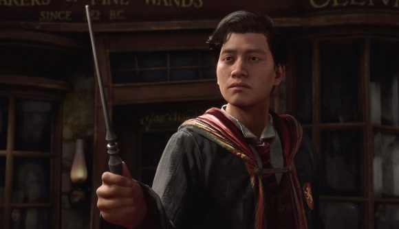 Hogwarts Legacy wand customisation: a wizard holds his wand