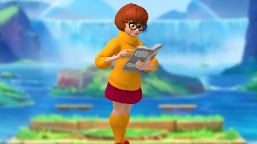MultiVersus Velma Combos: An image of a red-haired woman wearing an orange sweater reading
