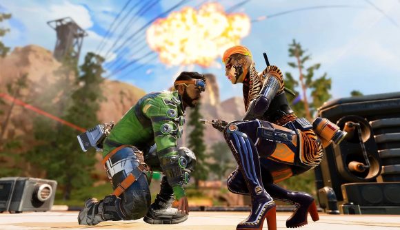 Apex Legends ranked Season 14 maps: Loba and Mirage face each other kneeling, while an explosion goes off on the sky above them