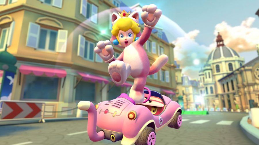 Mario Kart 8 Deluxe characters:  cat peach jumps out of her kart to celebrate
